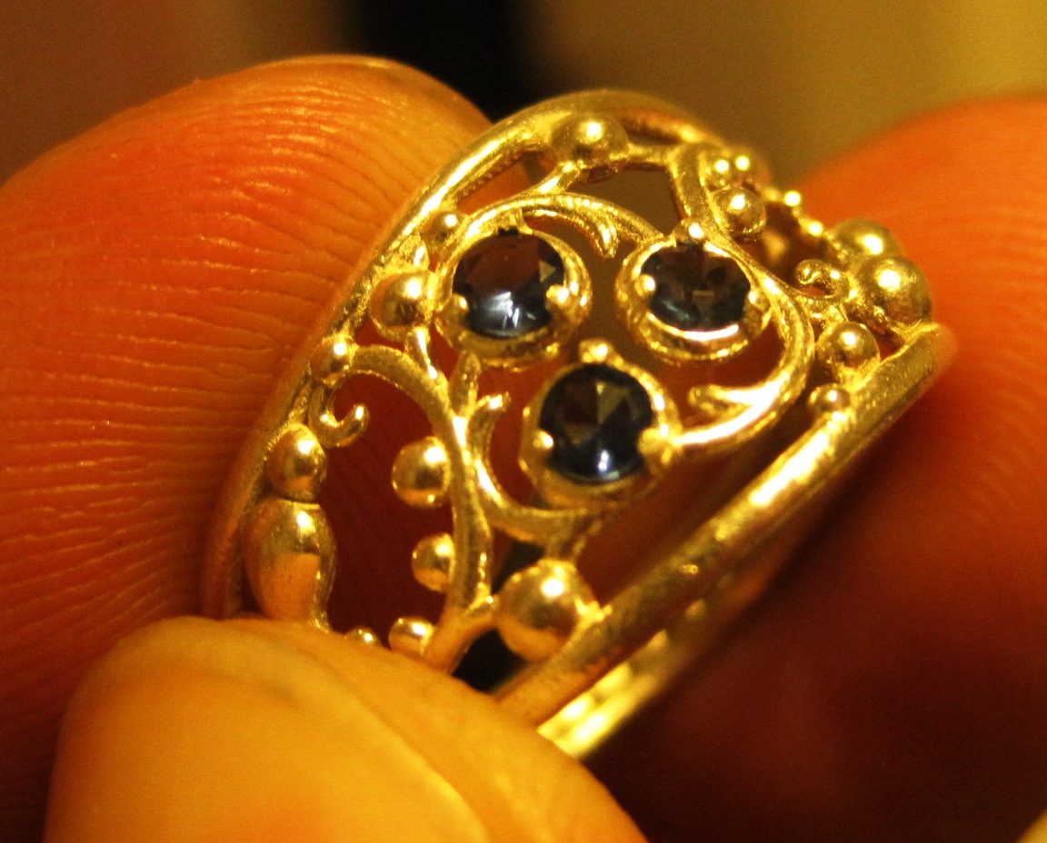 Custom silver ring with three blue gems